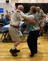 photo of two seniors dancing at the senior center