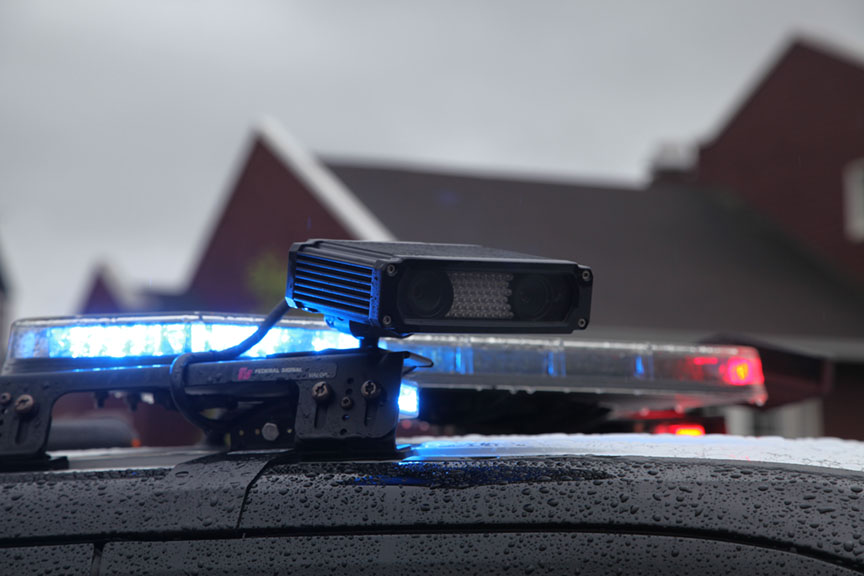 Photo of top of police car with automated license plate reader device