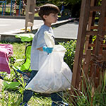 Image of kid cleaning up litter