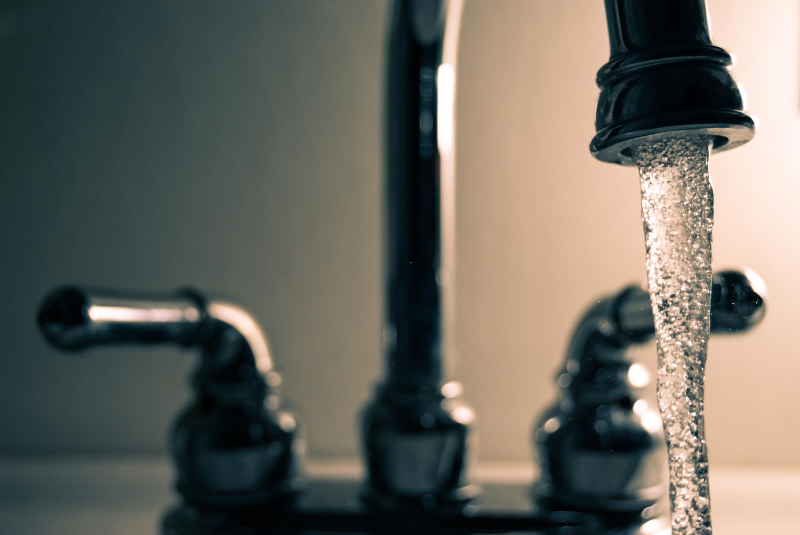 image of water running out of faucet